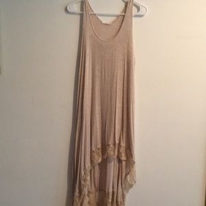 Sleeveless cream colored, lace trimmed dress